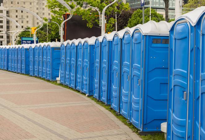 portable restrooms lined up at a marathon, ensuring runners can take a much-needed bathroom break in Donna